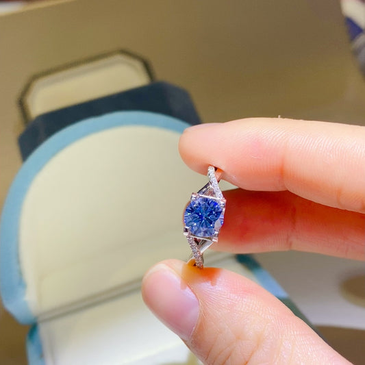 1 Carat Blue Round Brilliant Cut Moissanite Crisscross Pure Sterling Silver Ring - Sparkala